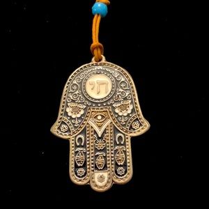 Hanging hamsa for good luck.